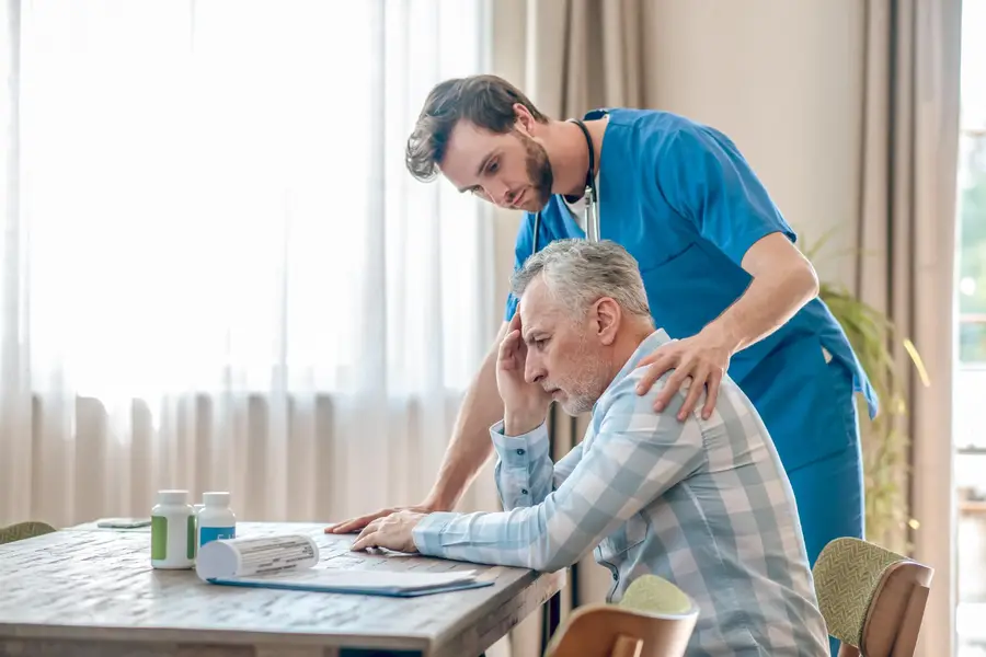 Healthcare provider conducting detailed assessment with patient managing complex chronic condition principal care management intensive monitoring session